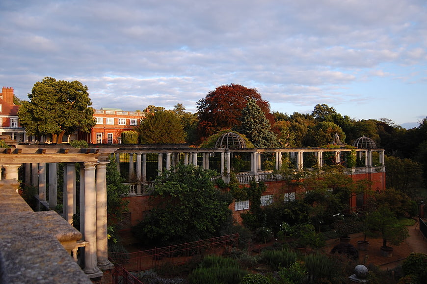 Classical colonnade and gardens at sunset in London