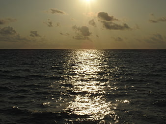 Golden Sunset Reflection on Ocean Waves