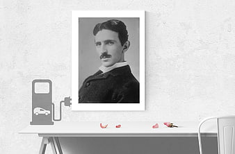 Framed Nikola Tesla Portrait On White Desk With Electric Car Charging Icon