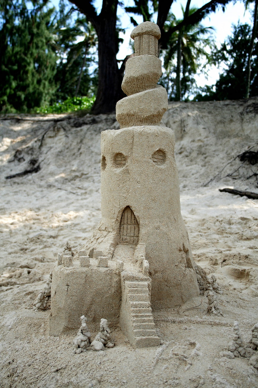 Detailed sand castle sculpture on a tropical beach