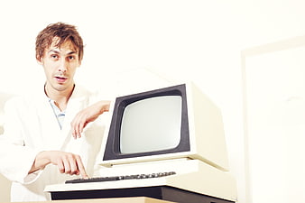 Man in Lab Coat Using Vintage Retro Computer