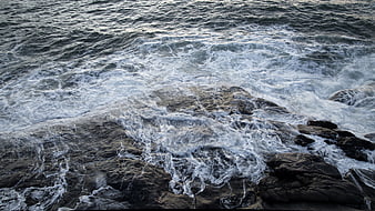 Ocean Waves Crashing on Rocky Shoreline