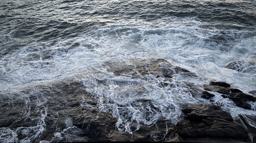 Ocean Waves Crashing on Rocky Shoreline