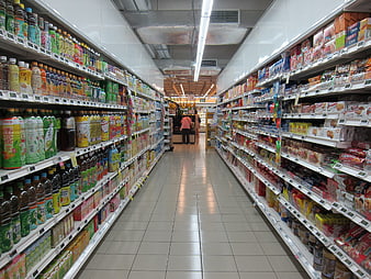 Supermarket aisle with beverages and snacks