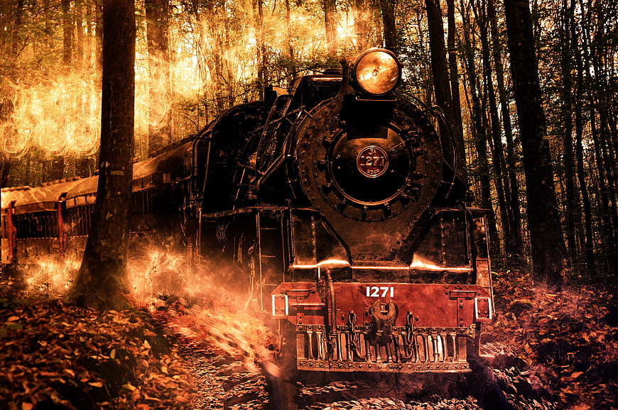 Vintage steam locomotive 1271 in autumn forest with fire effects