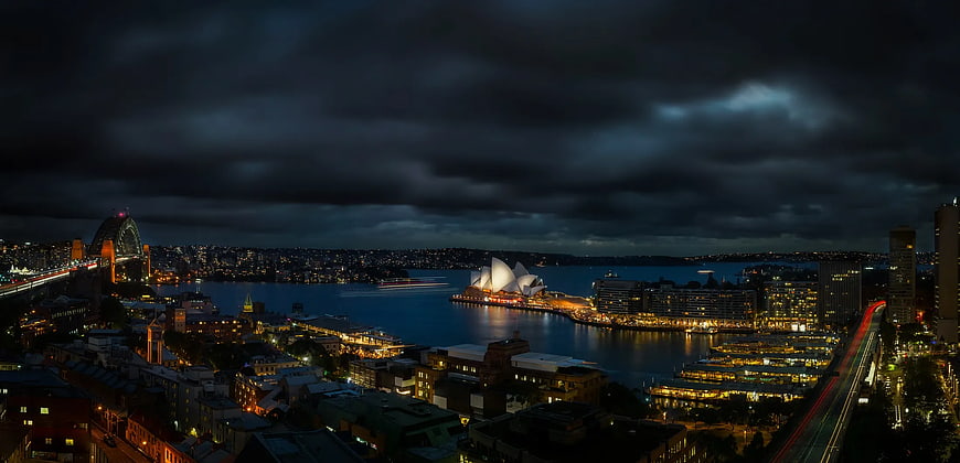 Dramatic Night Panorama of Sydney Opera House and Harbour Bridge
