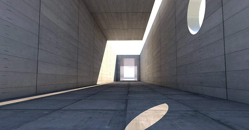 Minimalist concrete corridor with dramatic natural light
