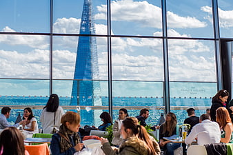 People dining at The Shard terrace with London skyline view