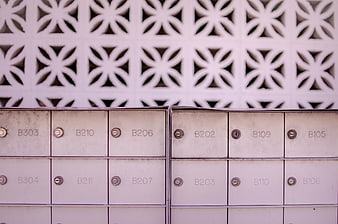 Metal mailboxes with decorative lattice background