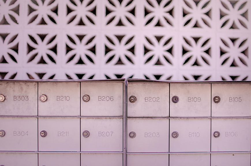 Metal mailboxes with decorative lattice background