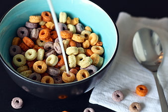 Colorful Fruit Loops Cereal with Milk Pouring