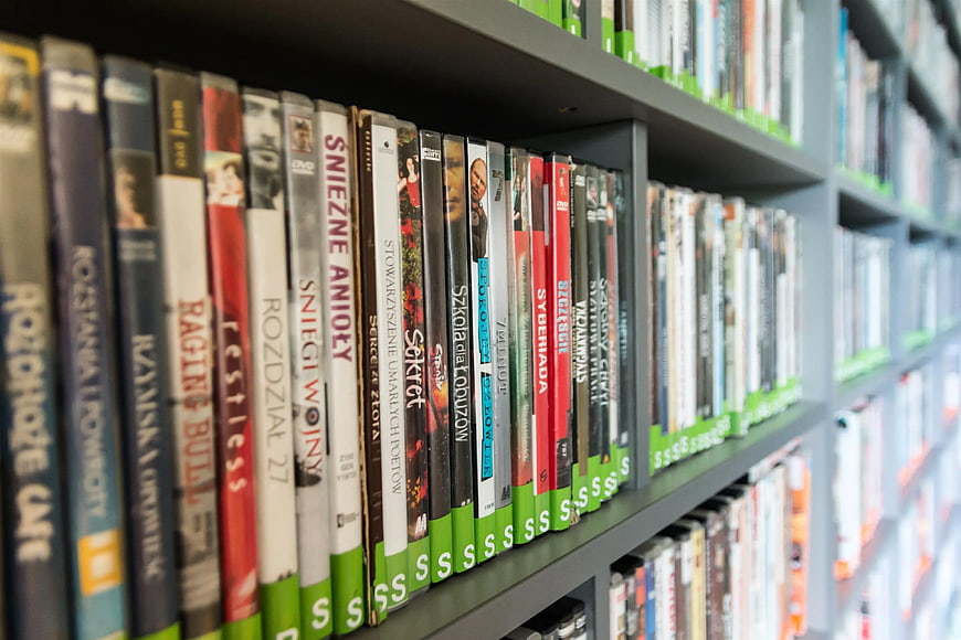 Rows of DVD Cases on Library Shelves