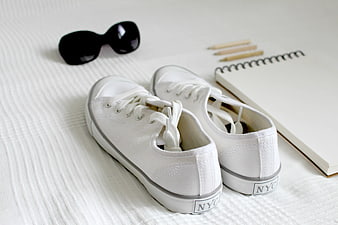 White NYC Sneakers with Notebook and Sunglasses