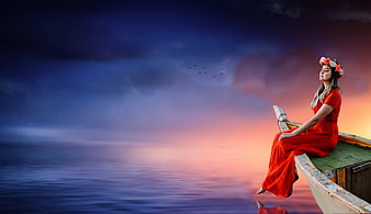 Woman in Red Dress Sitting on Boat at Sunset