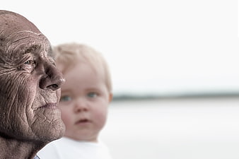 Senior Man Profile With Blurred Child In Background