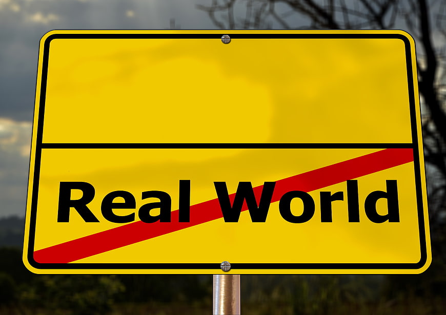 Conceptual Yellow Road Sign With Real World Text And Red Slash