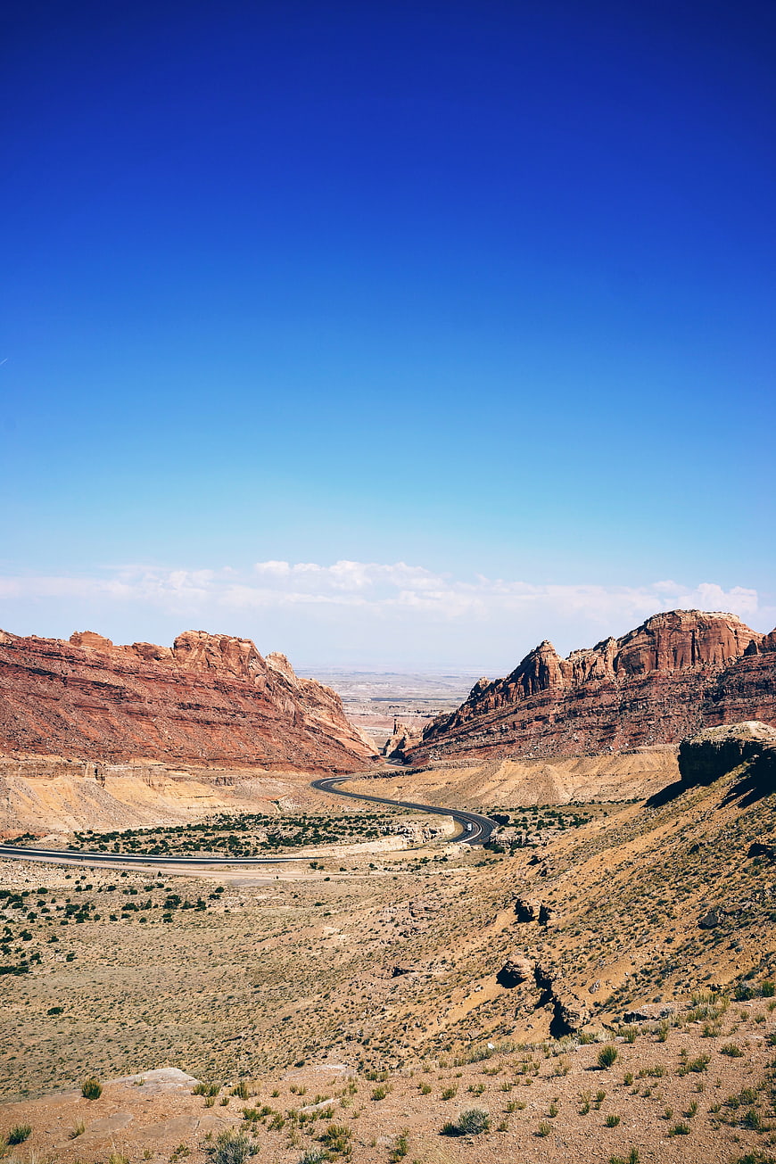 Winding Road Through Red Rock Desert Canyon Landscape