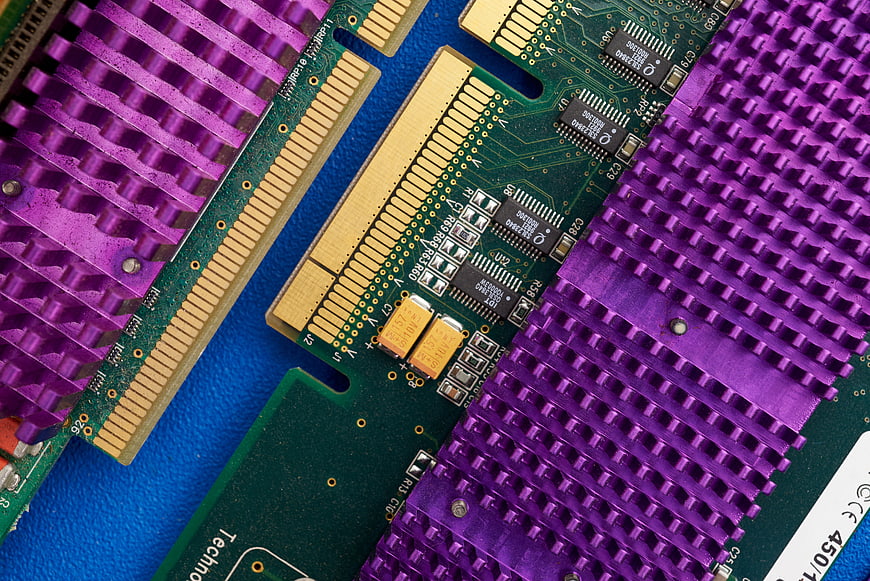 Close-up of purple computer circuit board with heat sink