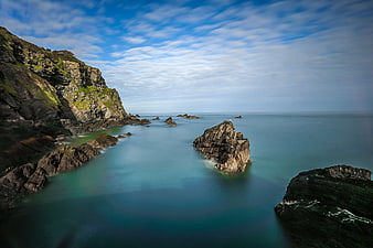Long Exposure Rocky Coastline with Smooth Ocean Water
