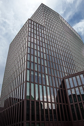 Low angle view of modern glass skyscraper architecture