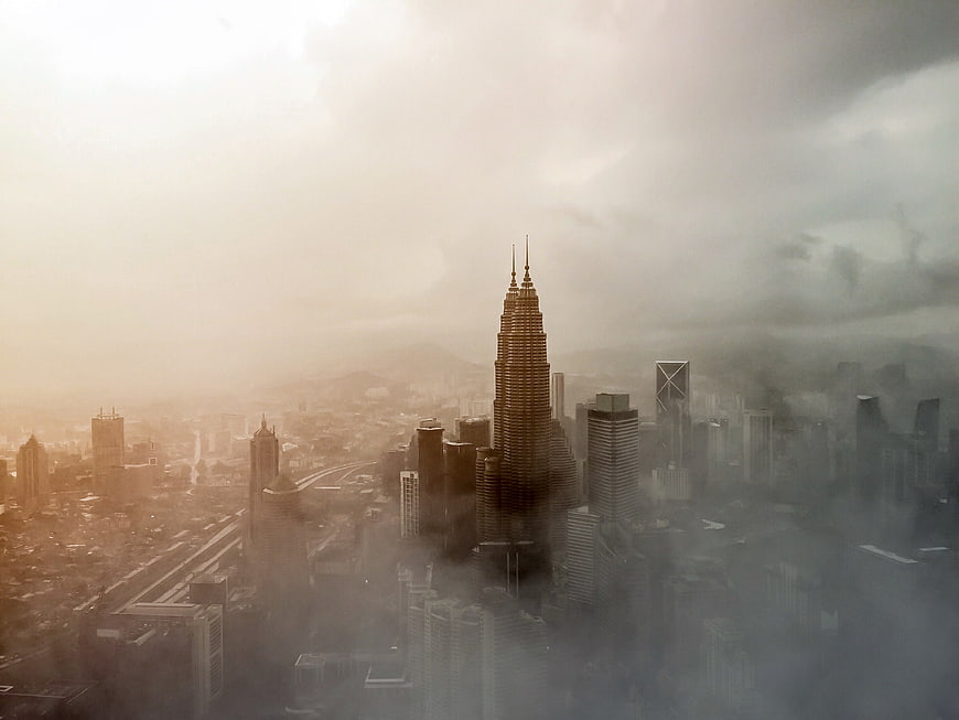 Atmospheric Aerial View of Kuala Lumpur City Skyline in Fog