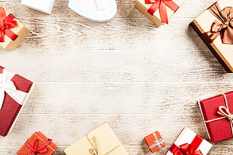 Christmas Gift Boxes Flat Lay With Copyspace On White Wooden Table