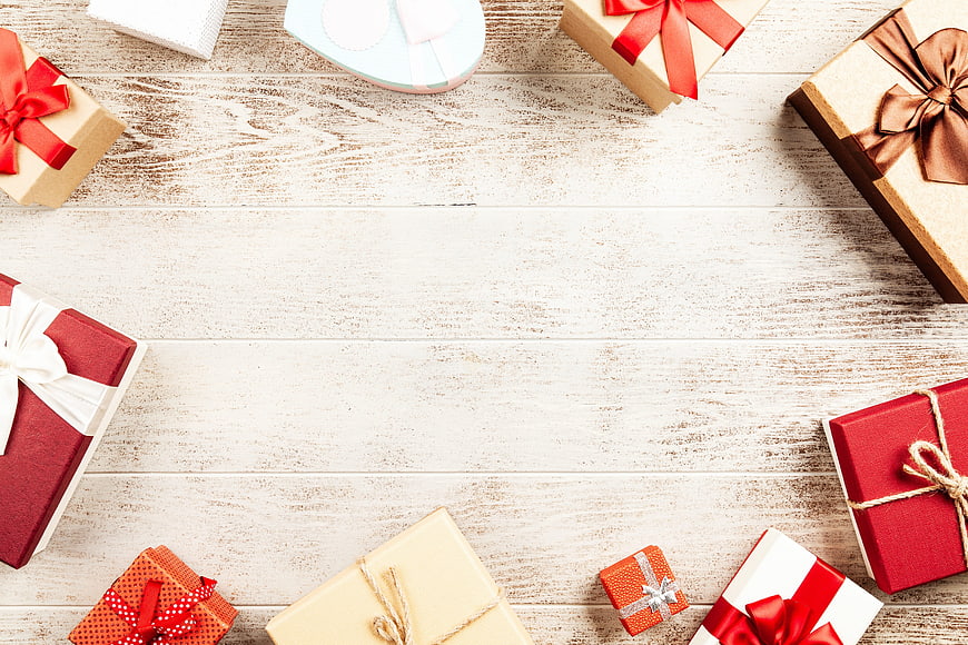 Christmas Gift Boxes Flat Lay With Copyspace On White Wooden Table