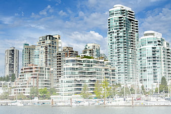 Modern High-Rise Cityscape with Marina and Boats
