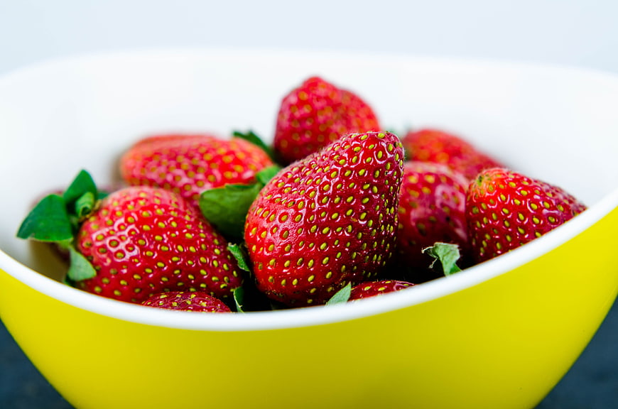 Fresh Red Strawberries in a Yellow Bowl