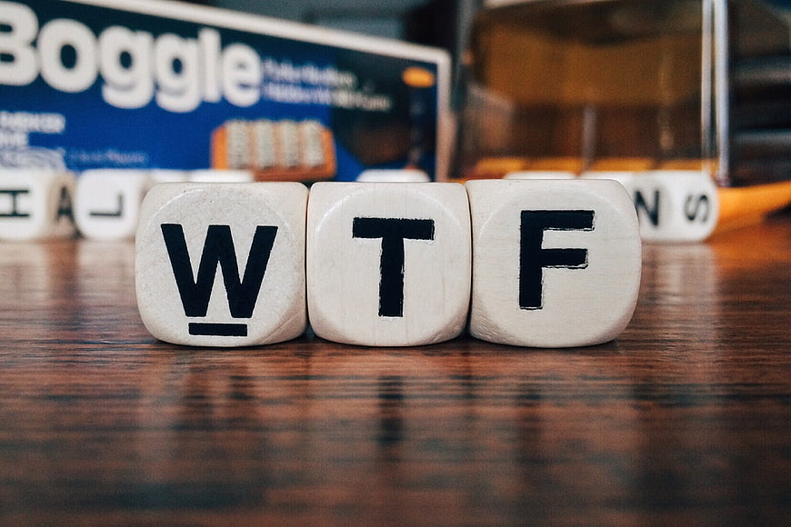 WTF Acronym Spelled Out With Wooden Letter Tiles On Table