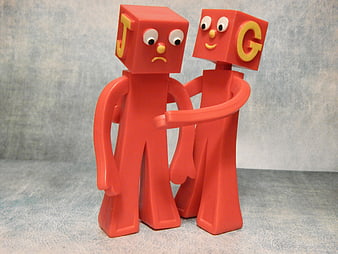 Red Alphabet Block Figures Embracing in Comforting Hug