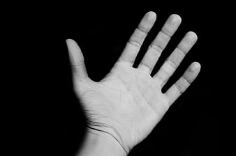 Black and white open hand palm gesture on black background