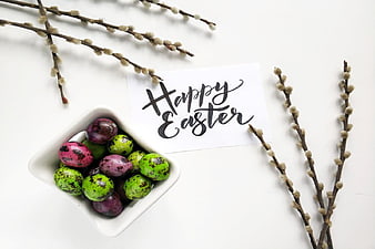Happy Easter card with colorful eggs and pussy willow branches