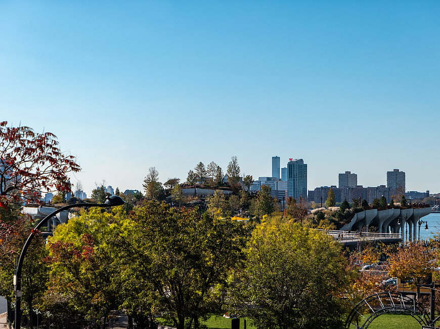 Autumn Park View with Manhattan Skyline and Modern Architecture