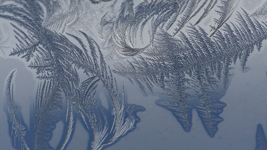 Frost Crystals On Glass Surface