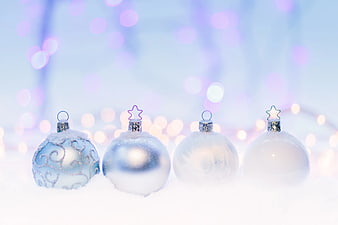 Blue and White Christmas Ornaments in Snow with Bokeh