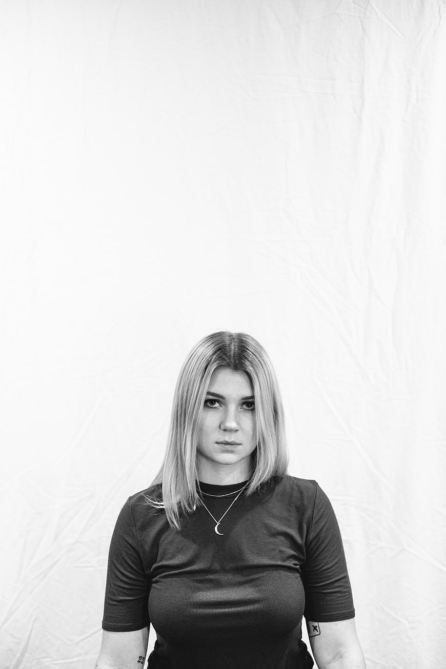 Black and white portrait of a young woman with blonde hair