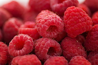Close-up of fresh red raspberries with detailed texture