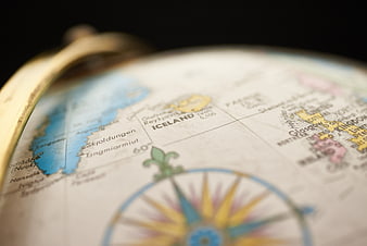 Close-up of vintage globe focusing on Iceland and compass rose
