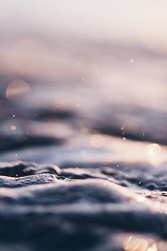 Abstract Ocean Waves with Soft Bokeh and Golden Light