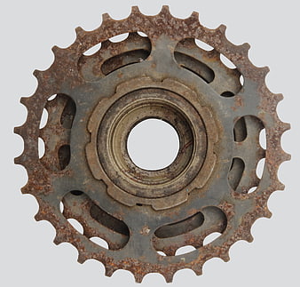Rusted Bicycle Sprocket Gear on White Background