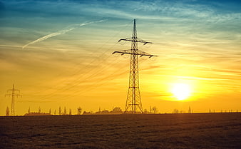 Silhouette of High Voltage Power Lines at Golden Sunset