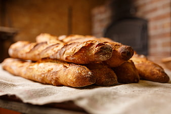 Freshly Baked Baguettes on Rustic Bakery Table