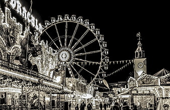 Sepia-toned night view of Frankfurt folk festival with Ferris wheel