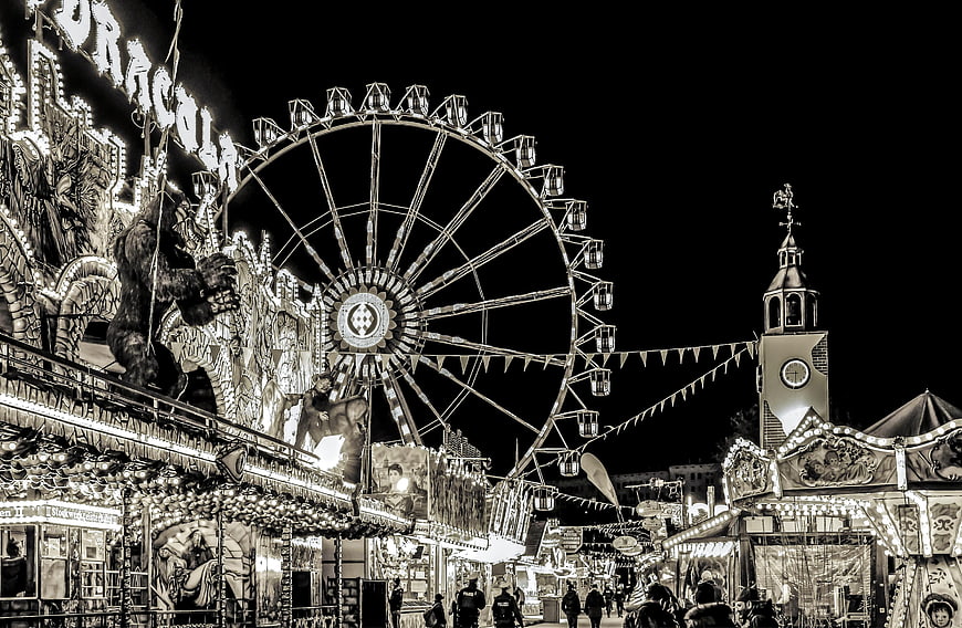 Sepia-toned night view of Frankfurt folk festival with Ferris wheel
