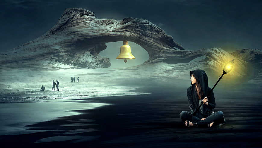 Surreal fantasy woman with lantern on dark beach