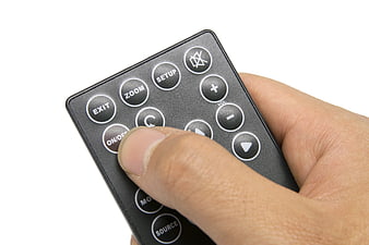 Hand Pressing Button On Black TV Remote Control