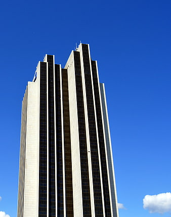 Tall modern skyscraper against clear blue sky