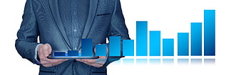 Businessman in suit holding tablet with blue bar chart graphic