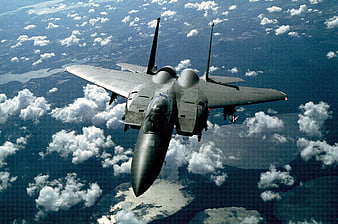 F-15 Eagle Fighter Jet Flying Above Clouds